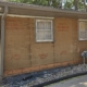 Removing two layers of siding.